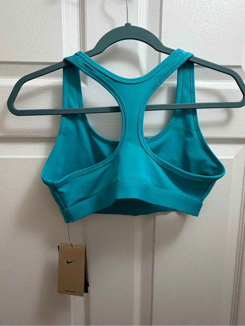 Nike Women’s Teal Sports Bra with White Swoosh